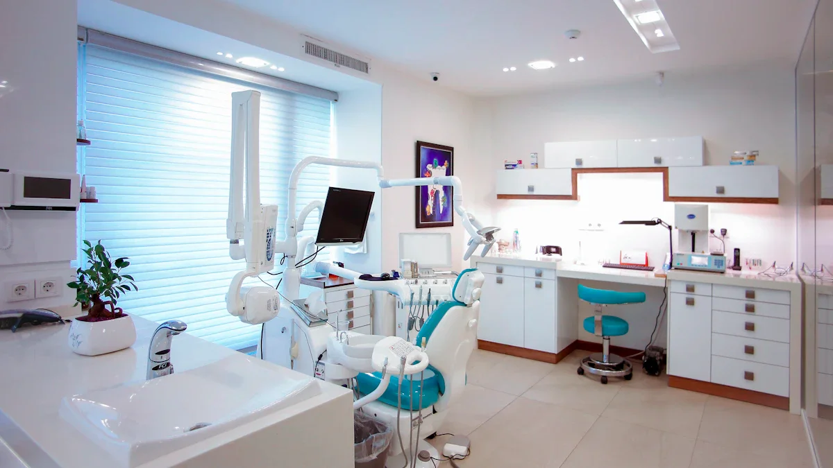 Modern dental treatment room with a patient chair, examination light and clinical equipment.